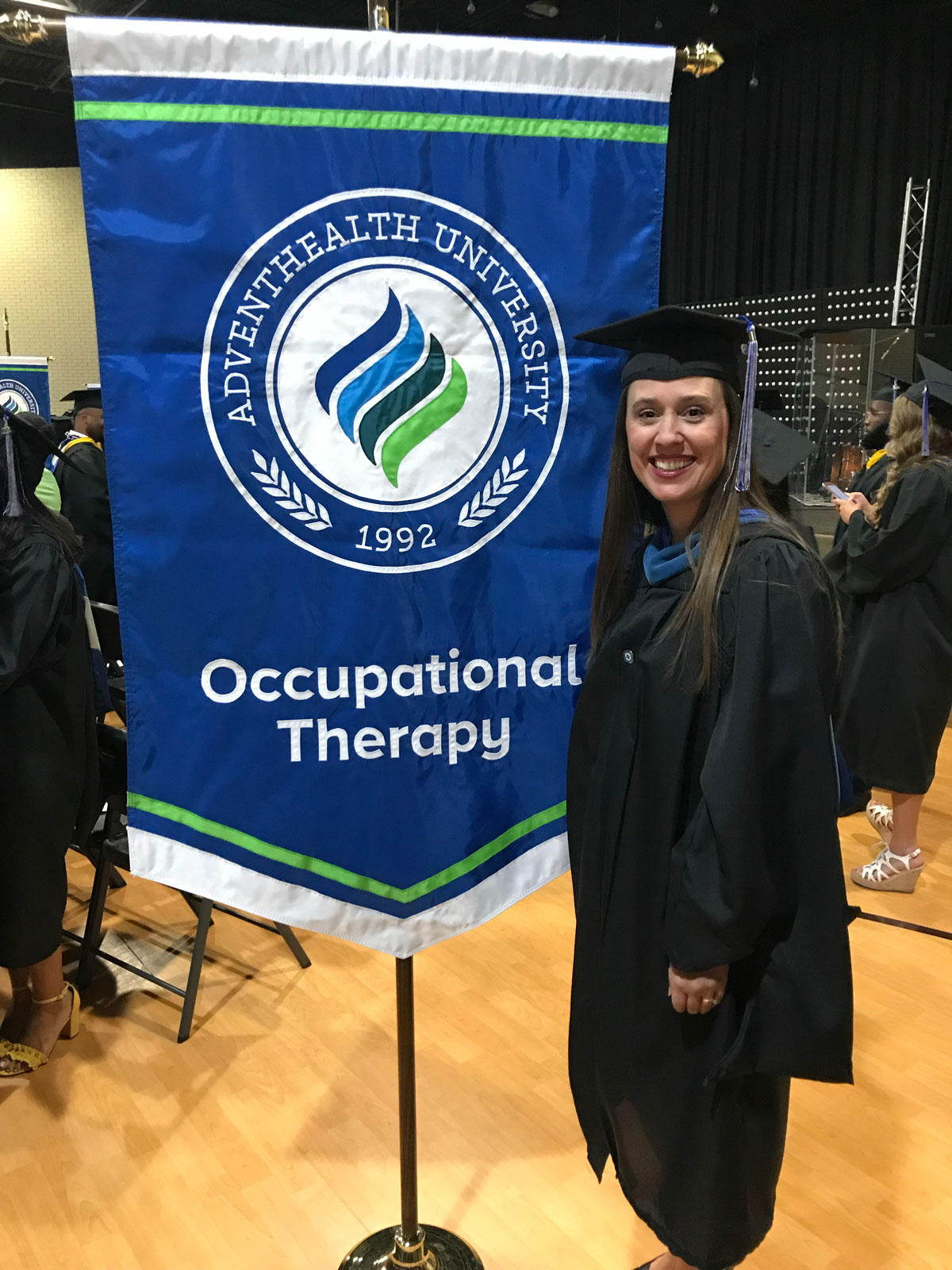Image of Bryn Nadeau a graduate of the occupational therapy program in regalia.