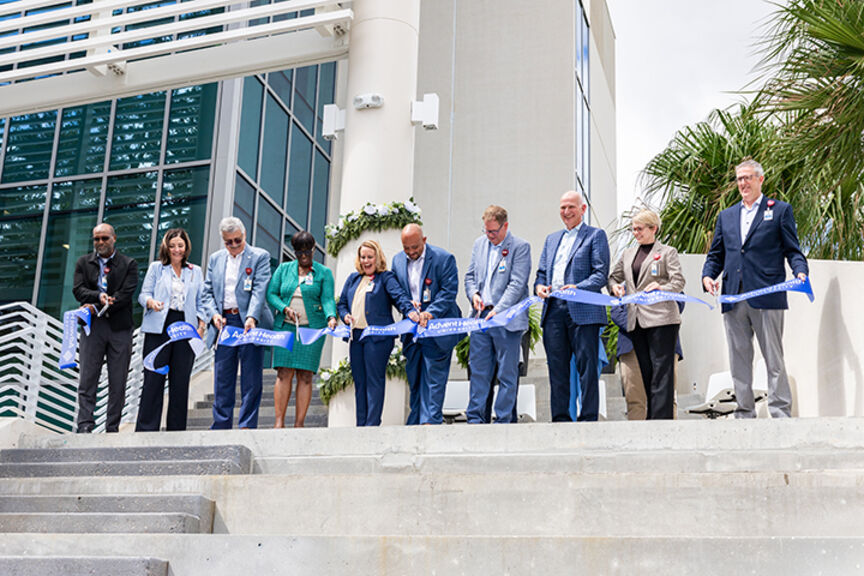 AHU and AdventHealth leaders cutting the ribbon at the opening of AHU's new simulation center