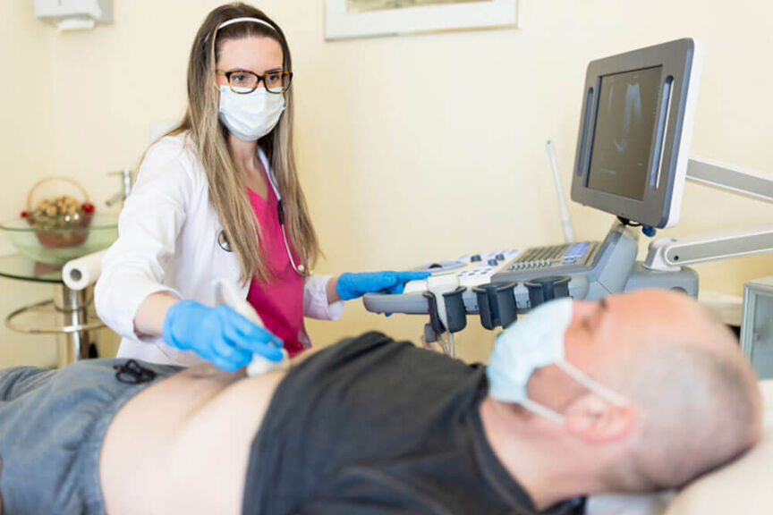 sonographer-examining-patient