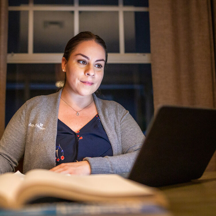 Nurse studying on a laptop