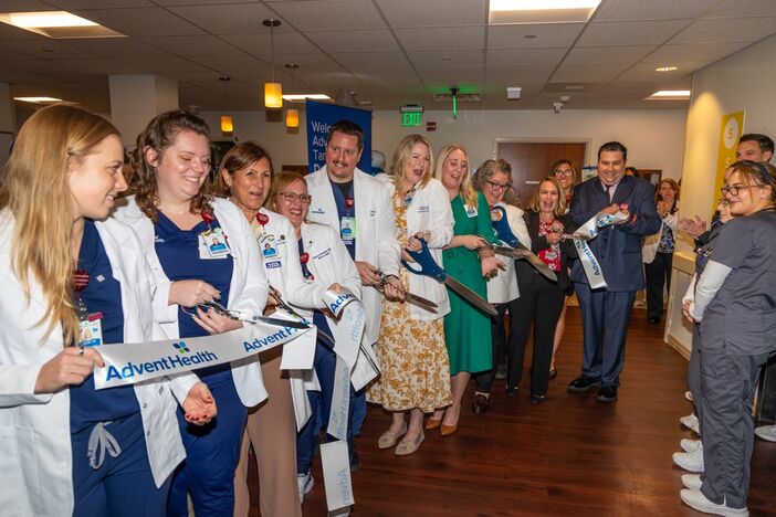 Nurses, students and AHU leaders cut the ribbon at the new dedicated education unit.
