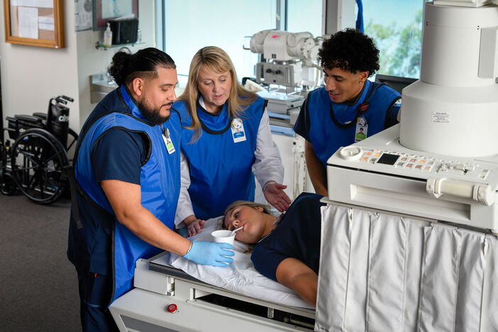 professor and students in radiography lab