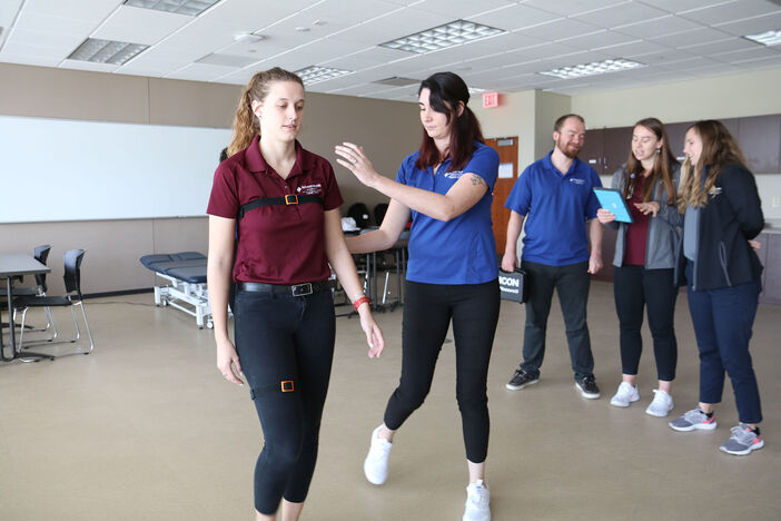 Physical therapy students conduct an experiment in the physical therapy research lab.