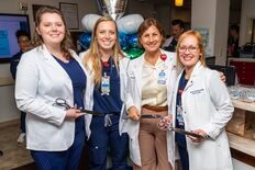 AdventHealth Tampa leaders at the ribbon cutting of the Dedicated Education Unit.