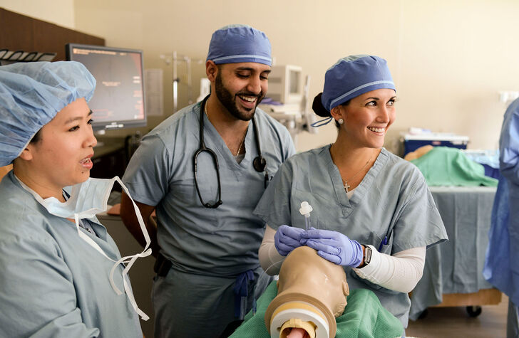 Nurse anesthesia students practicing intubation procedures in the skills lab