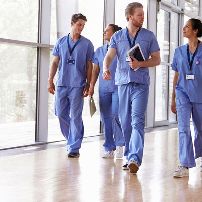 a group of nurses walking