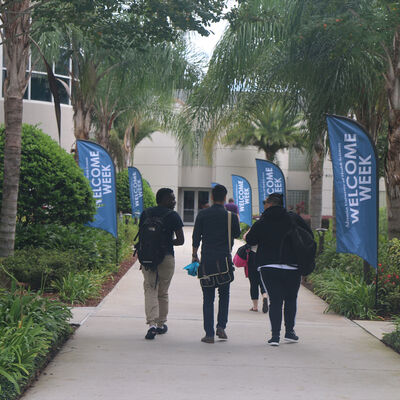 Students walking on campus during welcome week