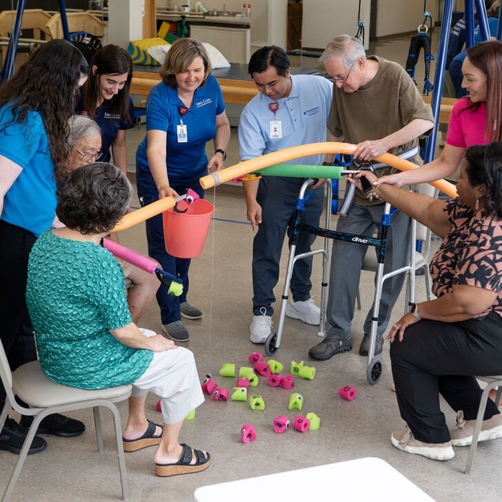 a group of people smiling and working together in the hope clinic.